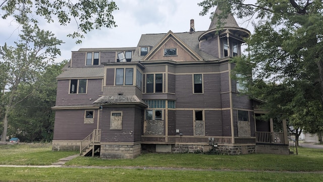 836 W N St, Kalamazoo, MI 49007 - rear view of property featuring a lawn and a chimney