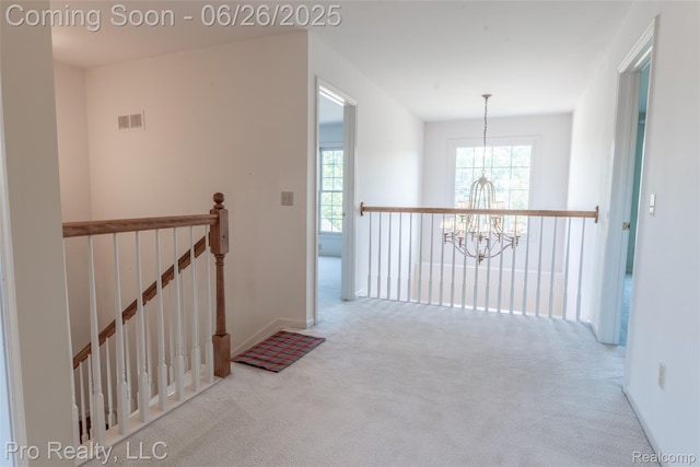 4233 Holly Ln, Rochester, MI 48306 - hallway with a chandelier, carpet flooring, and an upstairs landing