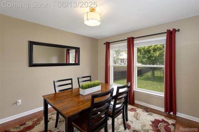 18885 English Ivy Dr, Macomb, MI 48042 - dining area with baseboards and wood finished floors