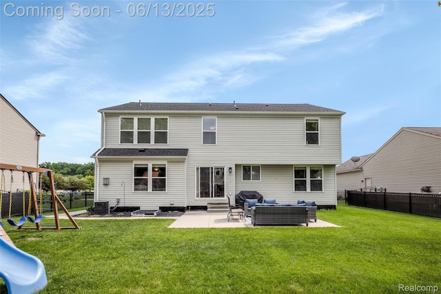 18885 English Ivy Dr, Macomb, MI 48042 - rear view of house with an outdoor hangout area, a playground, a patio area, and entry steps