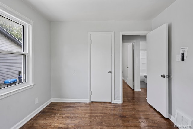 337 Burroughs Ave, Flint, MI 48507 - unfurnished bedroom with wood finished floors and baseboards