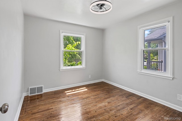 337 Burroughs Ave, Flint, MI 48507 - unfurnished room with dark wood-style flooring and baseboards