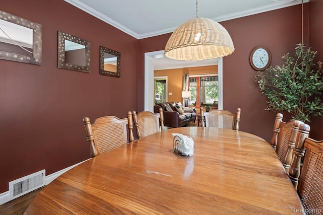 819 N Ball St, Owosso, MI 48867 - dining space featuring ornamental molding