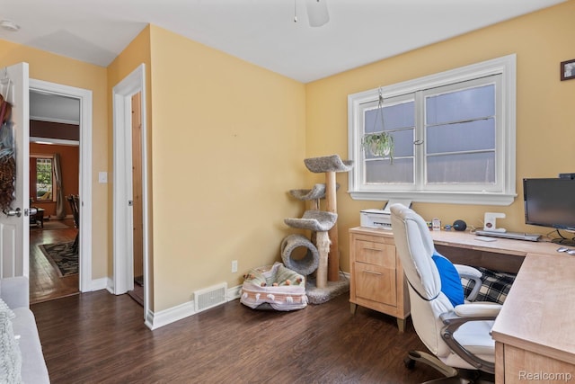 819 N Ball St, Owosso, MI 48867 - home office with dark wood-style floors, baseboards, and a ceiling fan