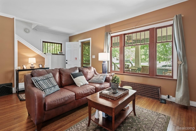 819 N Ball St, Owosso, MI 48867 - living room with hardwood / wood-style flooring, crown molding, and baseboards