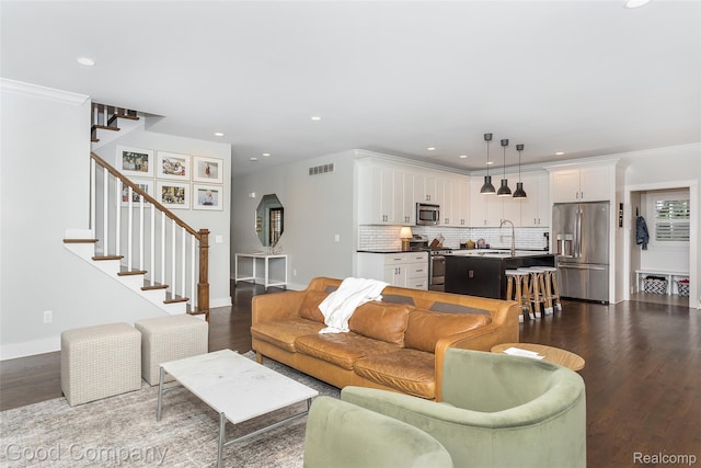 1017 N Maple Ave, Royal Oak, MI 48067 - living area with dark wood-style flooring, stairway, recessed lighting, baseboards, and crown molding