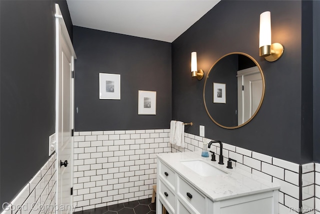 1017 N Maple Ave, Royal Oak, MI 48067 - bathroom featuring tile walls, vanity, a wainscoted wall, and tile patterned flooring