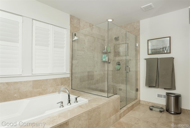 1017 N Maple Ave, Royal Oak, MI 48067 - bathroom with a garden tub, a shower stall, tile patterned flooring, and baseboards