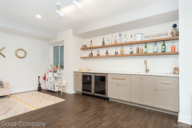 1017 N Maple Ave, Royal Oak, MI 48067 - indoor wet bar featuring beverage cooler, backsplash, dark wood-type flooring, recessed lighting, and baseboards