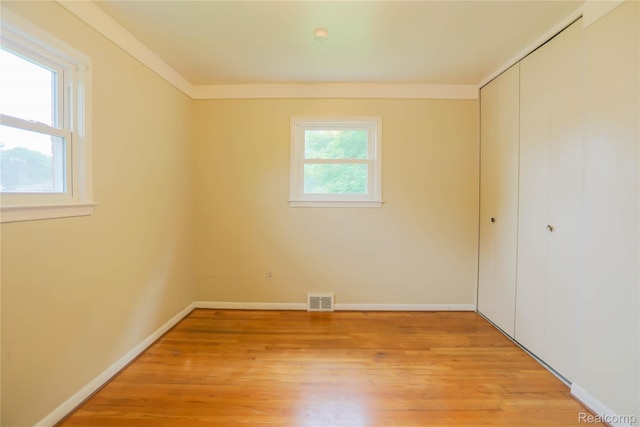 3581 Stolzenfeld Ave, Warren, MI 48091 - unfurnished bedroom featuring a closet, light wood-type flooring, and baseboards