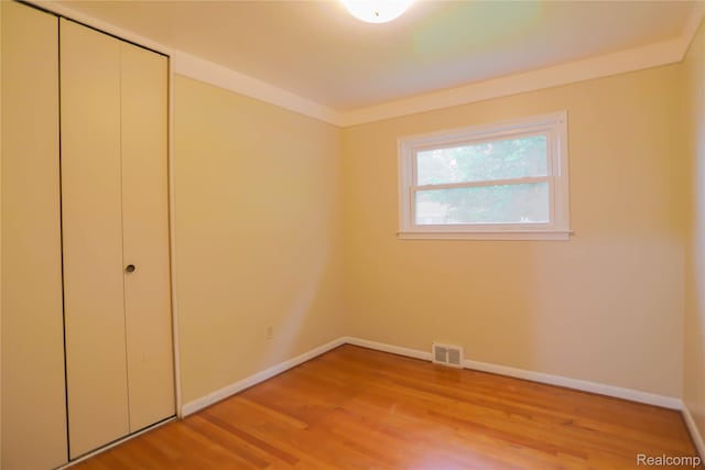 3581 Stolzenfeld Ave, Warren, MI 48091 - unfurnished bedroom featuring light wood finished floors, baseboards, and a closet
