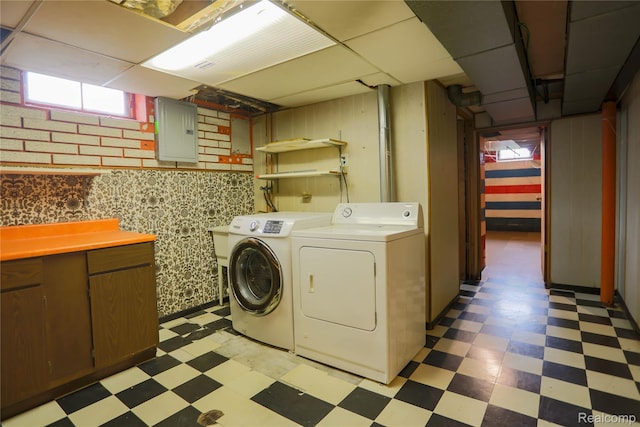 3581 Stolzenfeld Ave, Warren, MI 48091 - washroom with light floors, electric panel, washer and clothes dryer, and cabinet space