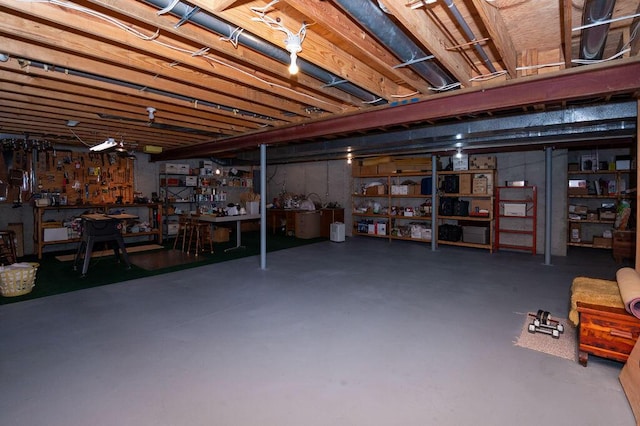1480 Nelson Rd, Saint Joseph, MI 49085 - unfinished basement featuring a workshop area