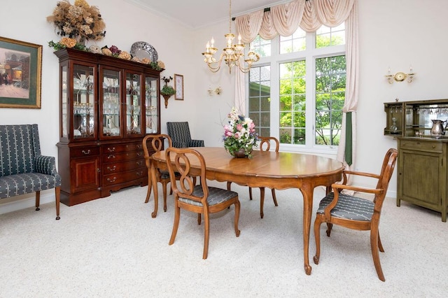 1480 Nelson Rd, Saint Joseph, MI 49085 - dining area featuring a chandelier, healthy amount of natural light, light colored carpet, and ornamental molding