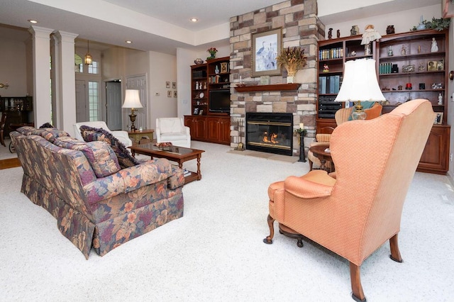 1480 Nelson Rd, Saint Joseph, MI 49085 - living room with light colored carpet, recessed lighting, and a stone fireplace