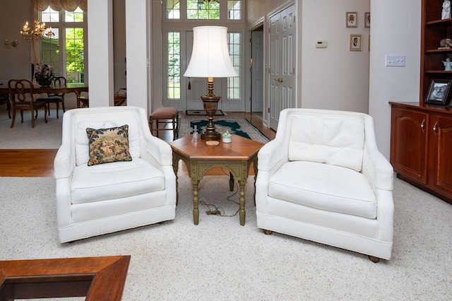 1480 Nelson Rd, Saint Joseph, MI 49085 - sitting room featuring plenty of natural light, a chandelier, and carpet floors