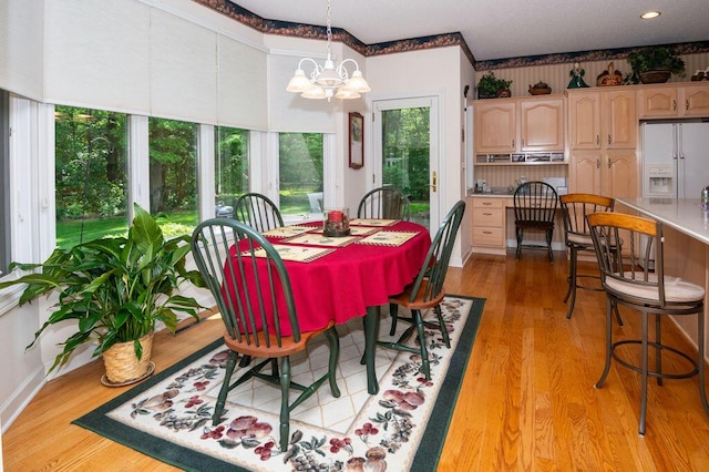 1480 Nelson Rd, Saint Joseph, MI 49085 - dining room featuring a chandelier and light wood-type flooring