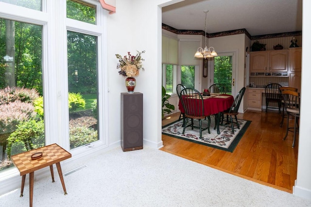 1480 Nelson Rd, Saint Joseph, MI 49085 - dining space with a chandelier and wood finished floors