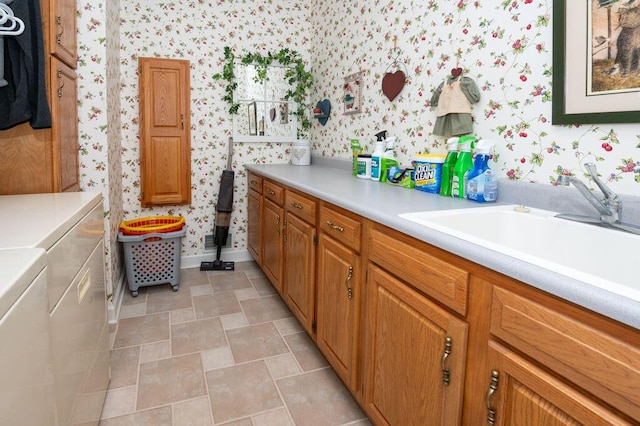 1480 Nelson Rd, Saint Joseph, MI 49085 - bathroom with wallpapered walls, separate washer and dryer, and a sink