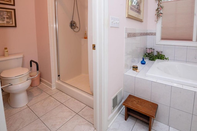 1480 Nelson Rd, Saint Joseph, MI 49085 - full bathroom featuring toilet, tile patterned flooring, a bath, and a shower stall