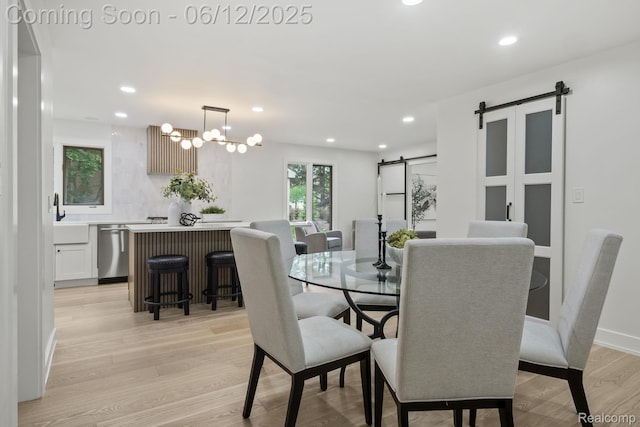 3405 Pine Estates Dr, Bloomfield Hills, MI 48323 - dining space with a barn door, light wood-style flooring, recessed lighting, and a chandelier