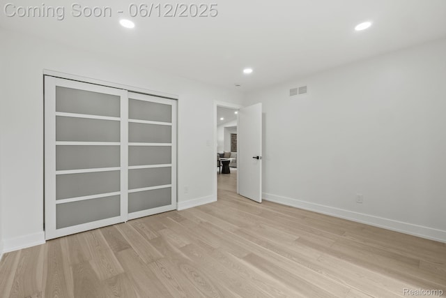 3405 Pine Estates Dr, Bloomfield Hills, MI 48323 - unfurnished bedroom featuring light wood-style flooring and recessed lighting
