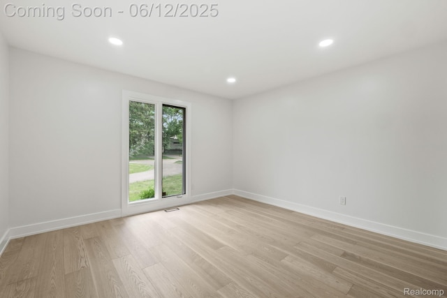 3405 Pine Estates Dr, Bloomfield Hills, MI 48323 - empty room with light wood-style flooring and recessed lighting