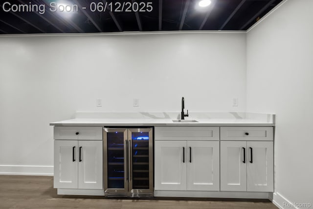 3405 Pine Estates Dr, Bloomfield Hills, MI 48323 - bar area featuring beverage cooler and wood finished floors