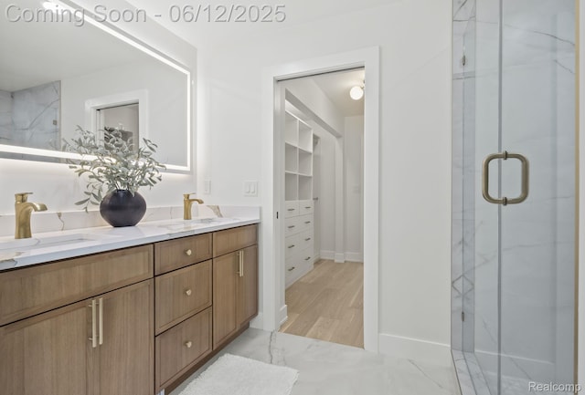 3405 Pine Estates Dr, Bloomfield Hills, MI 48323 - full bathroom featuring double vanity, a marble finish shower, and wood finished floors