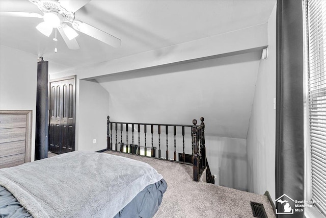 20036 Village Green Ct, Brownstown, MI 48183 - carpeted bedroom featuring a ceiling fan, vaulted ceiling, and a closet