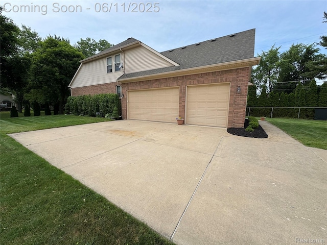 34444 Fargo St, Livonia, MI 48152 - view of side of home with brick siding, concrete driveway, a garage, and roof with shingles