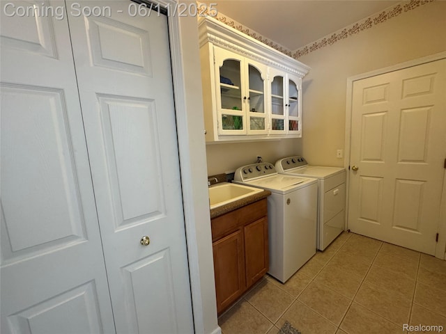 34444 Fargo St, Livonia, MI 48152 - laundry room featuring cabinet space, independent washer and dryer, and light tile patterned floors