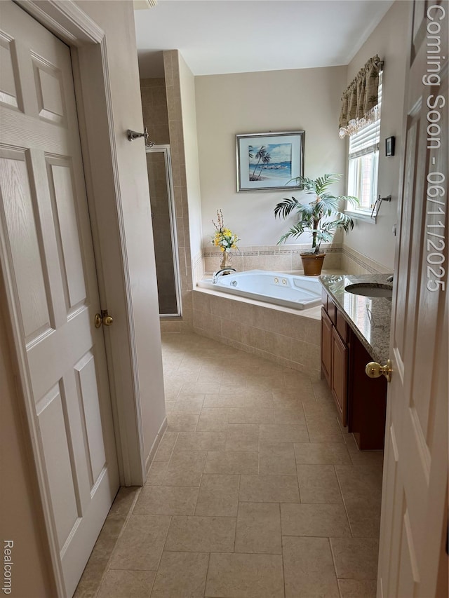 34444 Fargo St, Livonia, MI 48152 - full bath featuring vanity, a garden tub, a shower stall, and tile patterned floors