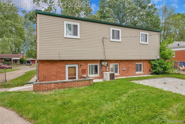 24113 Karen Ave, Warren, MI 48091 - rear view of house with cooling unit and brick siding