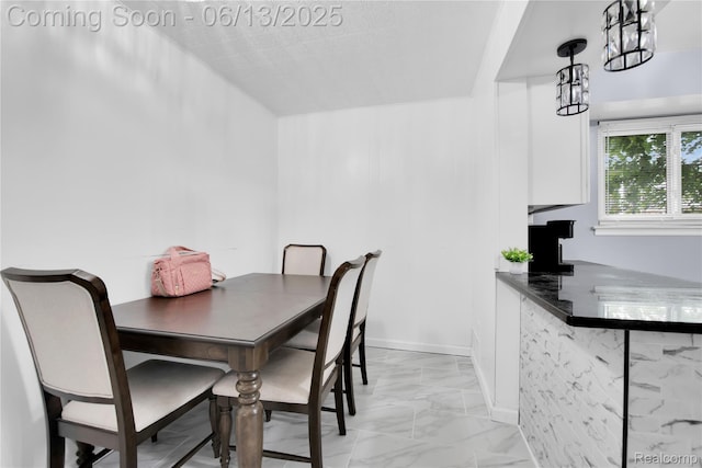 24113 Karen Ave, Warren, MI 48091 - dining area featuring light marble finish flooring