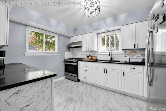 24113 Karen Ave, Warren, MI 48091 - kitchen with appliances with stainless steel finishes, a sink, under cabinet range hood, and healthy amount of natural light
