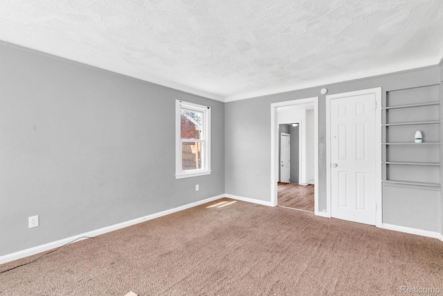 20069 Goulburn St, Detroit, MI 48205 - unfurnished bedroom with a textured ceiling, carpet, and baseboards