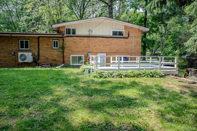 46254 Custer Ave, Utica, MI 48317 - back of house with brick siding, a lawn, and a deck