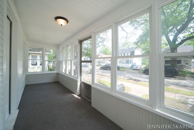 884 Emerson Ave, Muskegon, MI 49442 - unfurnished sunroom featuring plenty of natural light and radiator