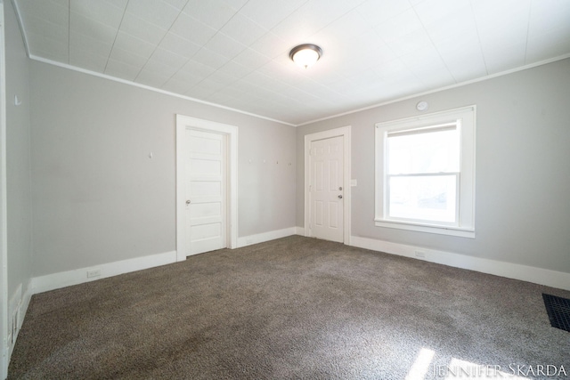 884 Emerson Ave, Muskegon, MI 49442 - carpeted empty room featuring ornamental molding and baseboards