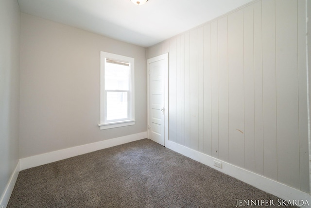 884 Emerson Ave, Muskegon, MI 49442 - carpeted empty room with baseboards