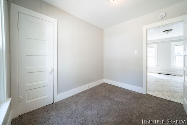 884 Emerson Ave, Muskegon, MI 49442 - spare room with carpet and baseboards