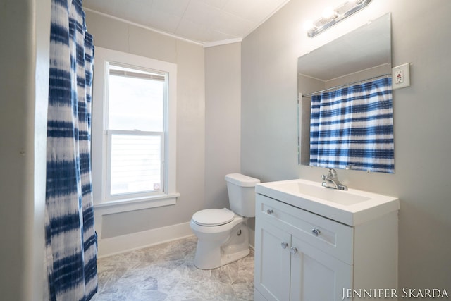 884 Emerson Ave, Muskegon, MI 49442 - full bathroom featuring toilet, vanity, baseboards, and crown molding