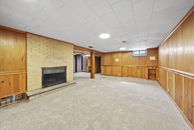 2618 Greencliff Dr, East Lansing, MI 48823 - below grade area featuring carpet, a brick fireplace, and wood walls