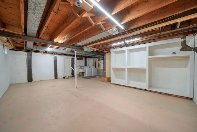 2618 Greencliff Dr, East Lansing, MI 48823 - unfinished basement featuring independent washer and dryer