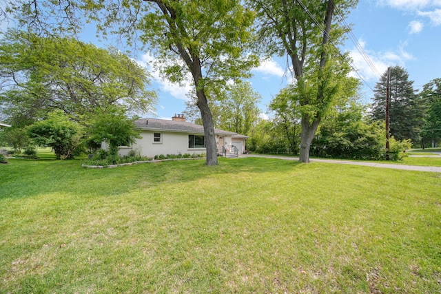 2618 Greencliff Dr, East Lansing, MI 48823 - view of green lawn with a garage