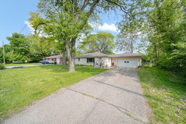 2618 Greencliff Dr, East Lansing, MI 48823 - ranch-style home featuring driveway, a garage, a chimney, and a front yard