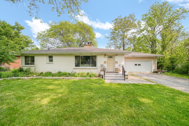2618 Greencliff Dr, East Lansing, MI 48823 - ranch-style house with driveway, a chimney, a garage, and a front yard