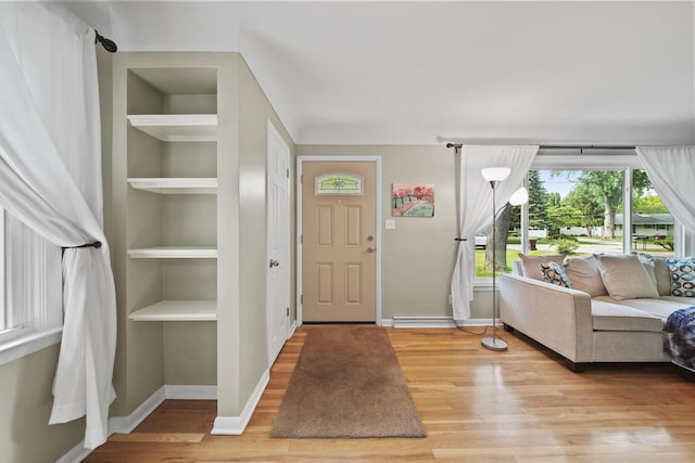 2618 Greencliff Dr, East Lansing, MI 48823 - entryway with light wood-style flooring and baseboards