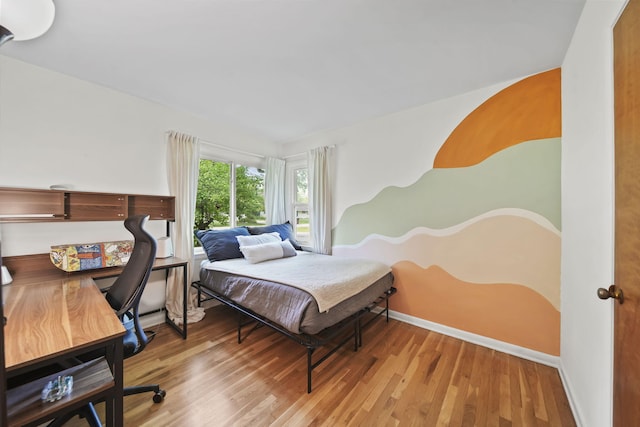2618 Greencliff Dr, East Lansing, MI 48823 - bedroom featuring wood finished floors, baseboards, and a desk